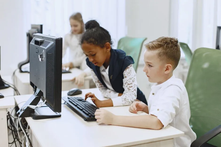 Students working at computers in a school computer lab