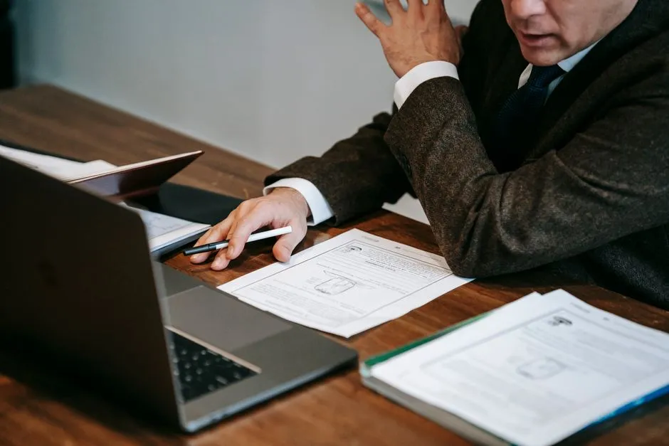Person working at a laptop, planning course materials
